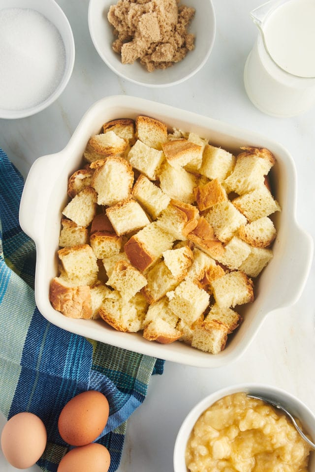 Cubed bread in baking dish