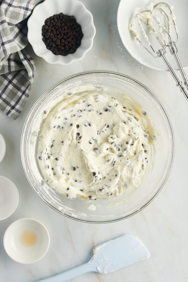 overhead view of cannoli dip in a glass mixing bowl