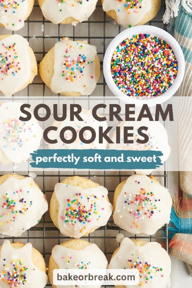 sour cream cookies and a small bowl of sprinkles on a wire rack; text overlay "sour cream cookies perfectly soft and sweet bakeorbreak.com"