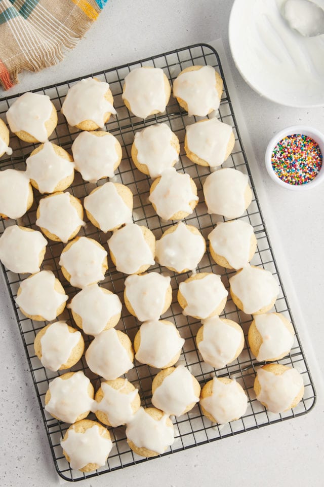 overhead view of glazed sour cream cookies on a wire rack