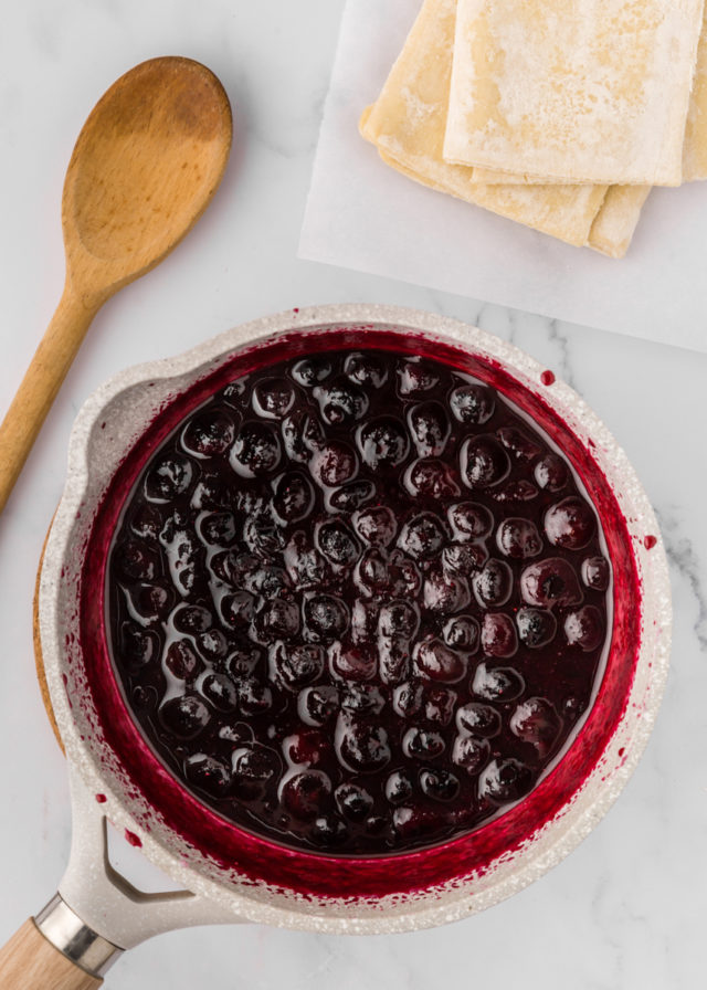 overhead view of cooked blueberry filling in a saucepan