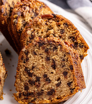slices of chocolate chip Bundt cake on a white cake plate