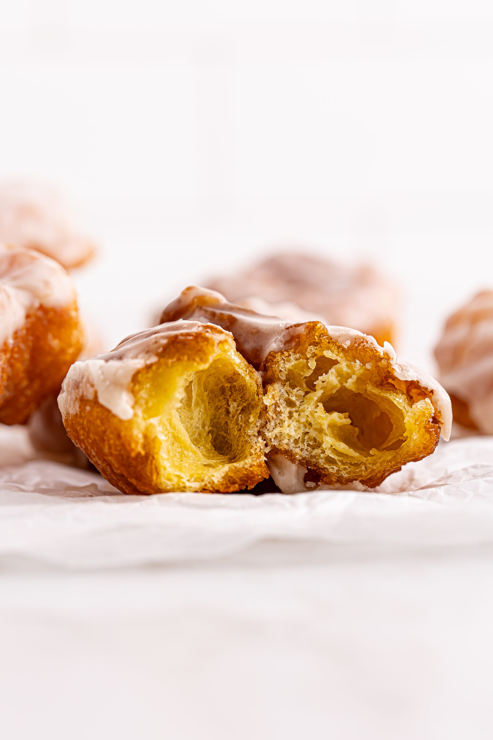 Halved French cruller to show airy interior