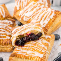 blueberry toaster strudels piled on parchment paper