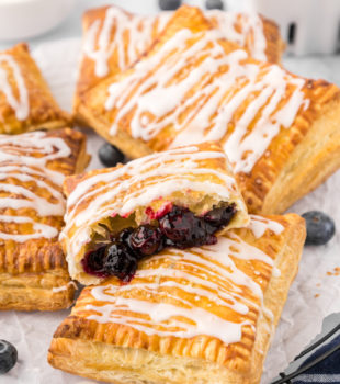 blueberry toaster strudels piled on parchment paper