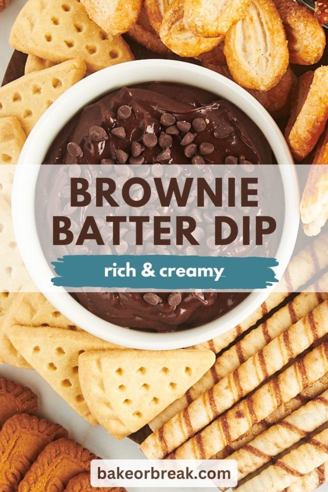 brownie batter dip in a white bowl with various dippers surrounding; text overlay "brownie batter dip rich & creamy bakeorbreak.com"