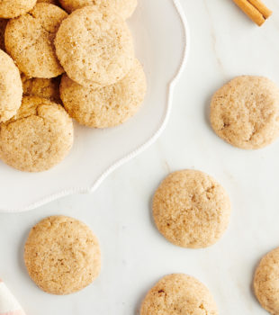 Overhead view of chai sugar cookies on counter and platter