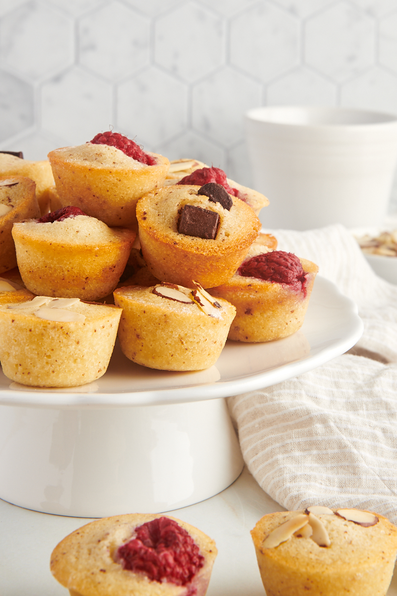 financiers served on a small white cake stand