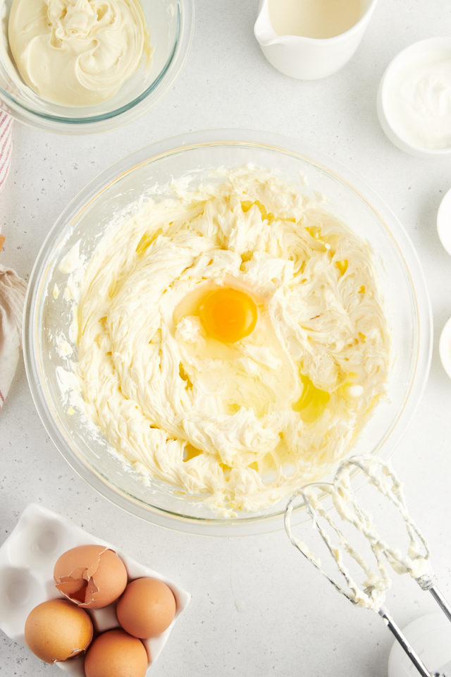 Overhead view of egg added to cream cheese mixture