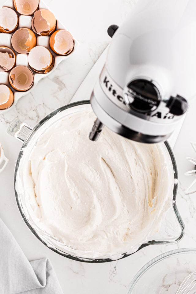 overhead view of angel food cake batter in the bowl of a stand mixer