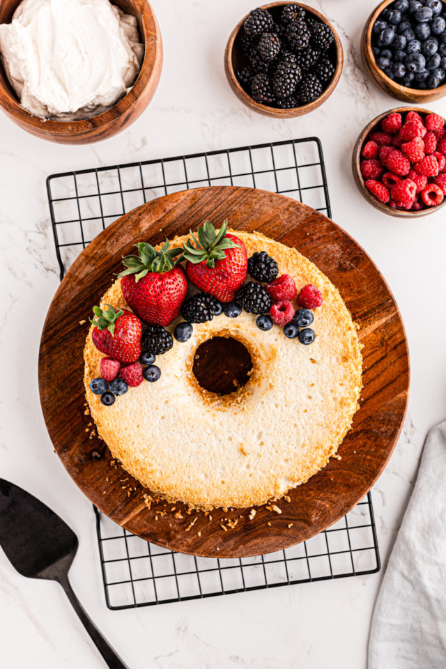 overhead view of angel food cake garnished with fresh berries