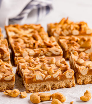 butterscotch cashew bars on parchment paper