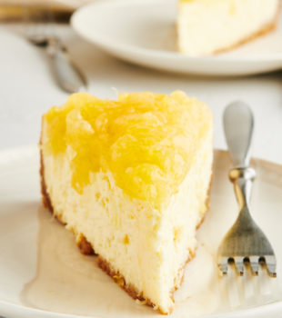 Head-on view of pineapple cheesecake slice on plate