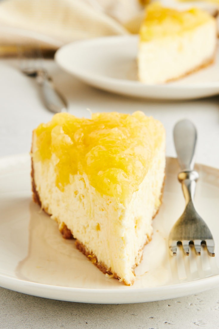 Head-on view of pineapple cheesecake slice on plate