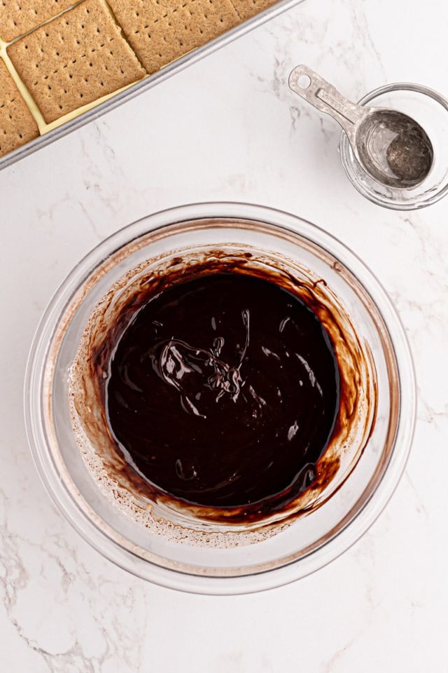 overhead view of chocolate ganache in a glass bowl