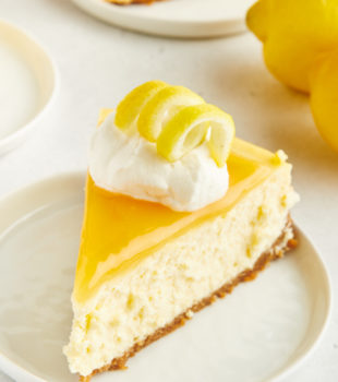 a slice of lemon cheesecake on a white plate