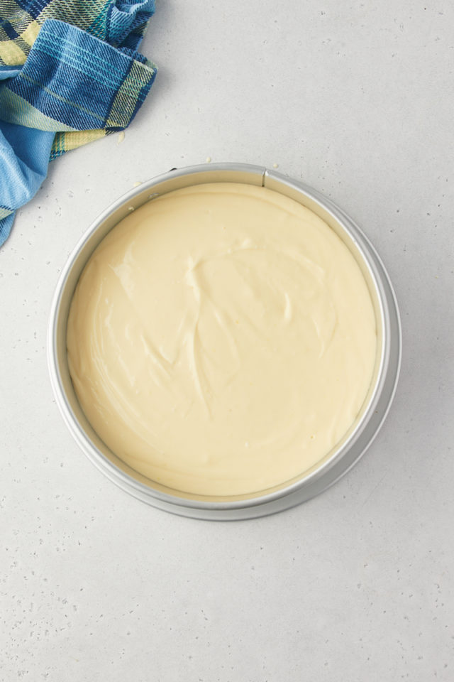 overhead view of lemon cheesecake filling in a springform pan