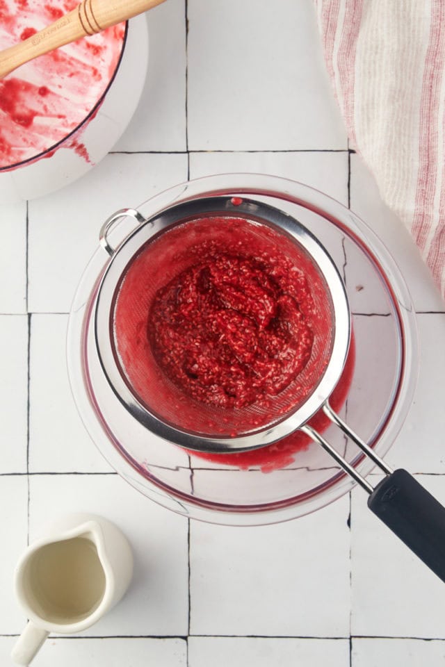 overhead view of remaining seeds after pressing raspberry coulis through a sieve