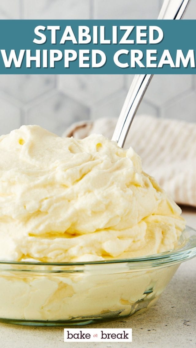stabilized whipped cream in a glass bowl with a spoon sticking into it; text overlay "stabilized whipped cream bake or break"