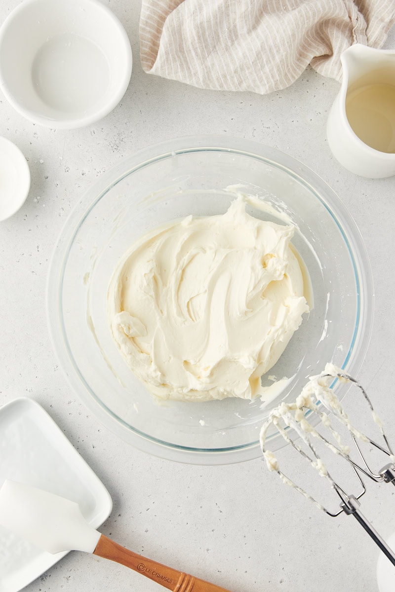 overhead view of stabilized whipped cream in a glass mixing bowl