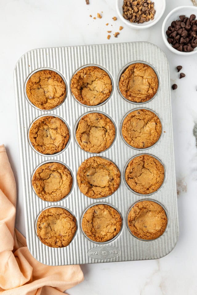 overhead view of freshly baked blondie cupcakes in a muffin pan