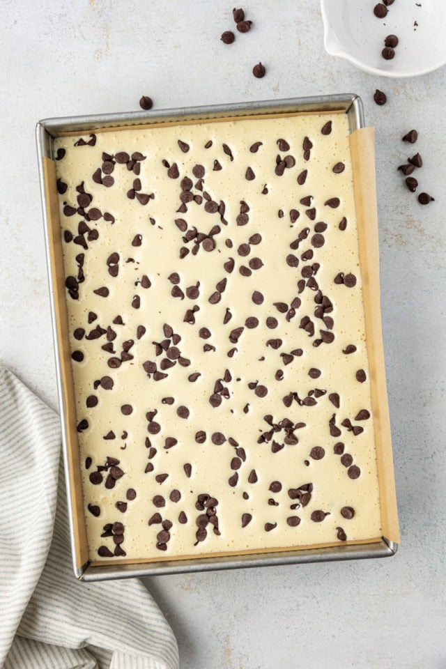 overhead view of assembled chocolate chip cheesecake brownies ready to go into the oven