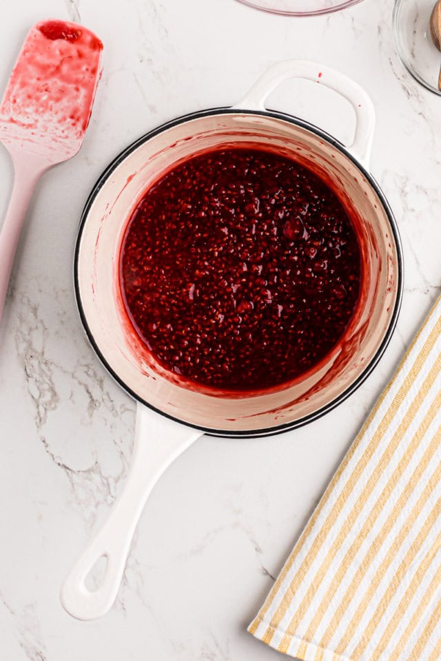 overhead view of fresh raspberry filling in a saucepan