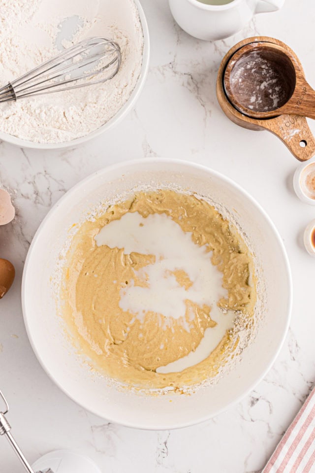 overhead view of milk added to strawberry coffee cake batter