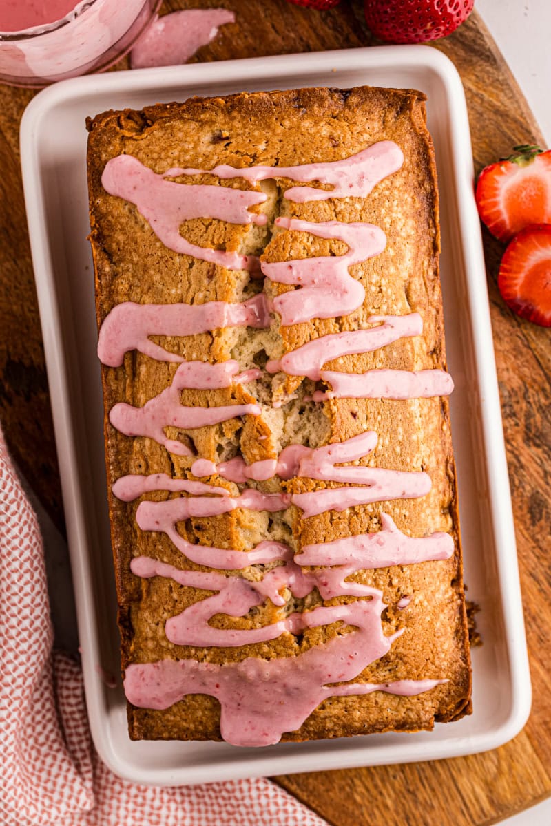 overhead view of strawberry pound cake with strawberry glaze drizzled over the top