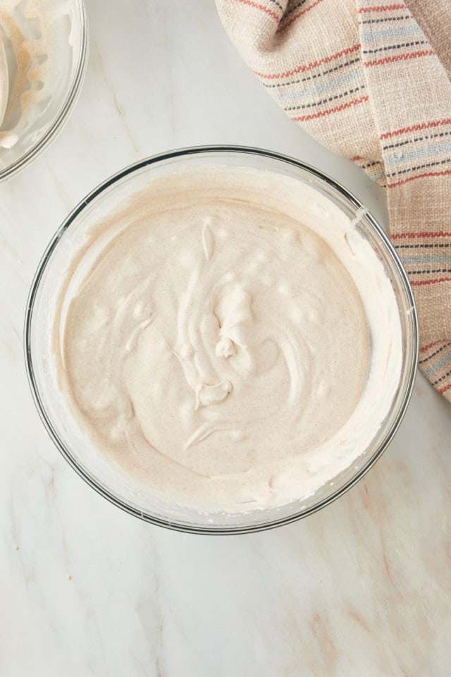 Overhead view of churro ice cream mixture in mixing bowl