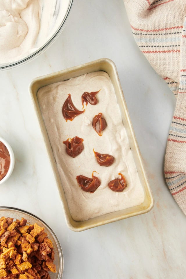 Overhead view of dulce de leche added to loaf pan