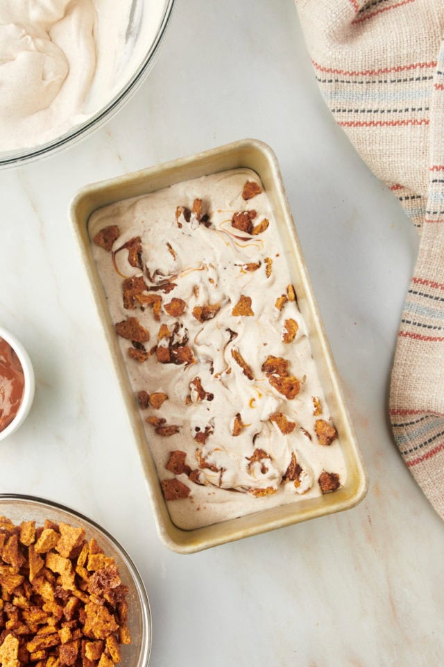 Overhead view of churro ice cream in loaf pan before freezing