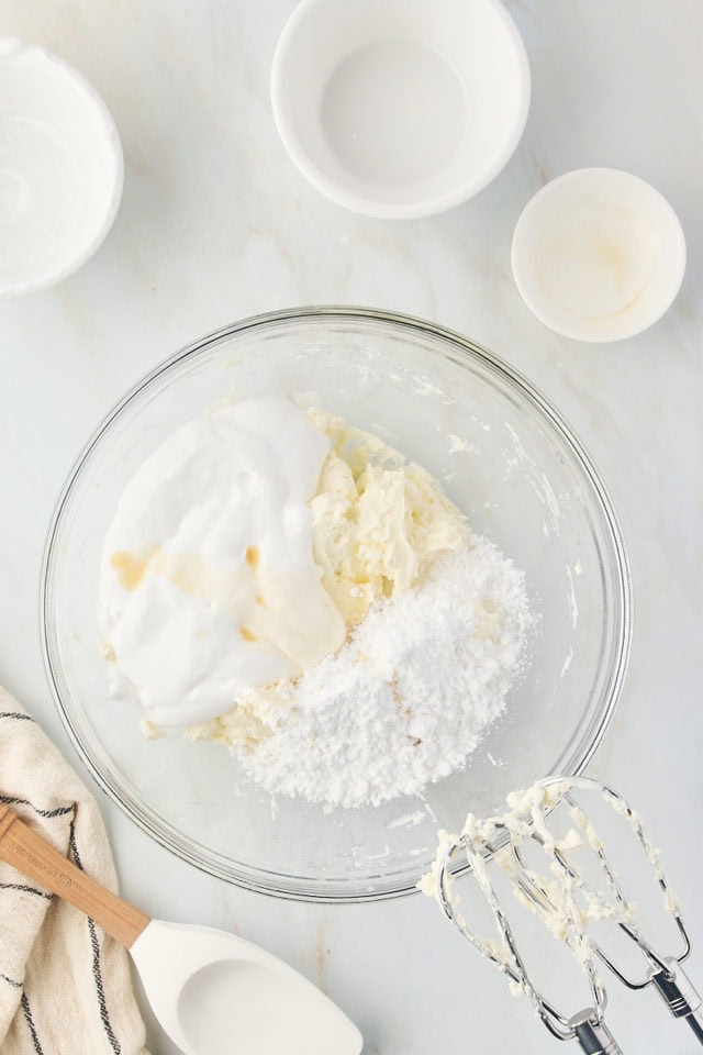 overhead view of marshmallow creme, confectioners' sugar, and vanilla extract added to beaten cream cheese