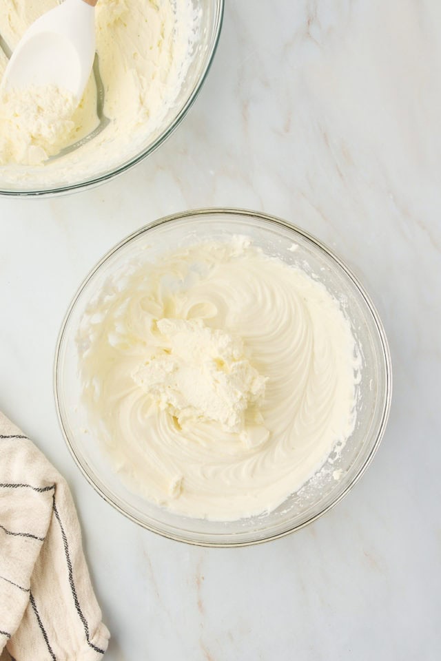 overhead view of whipped cream added to cream cheese mixture for s'mores pie