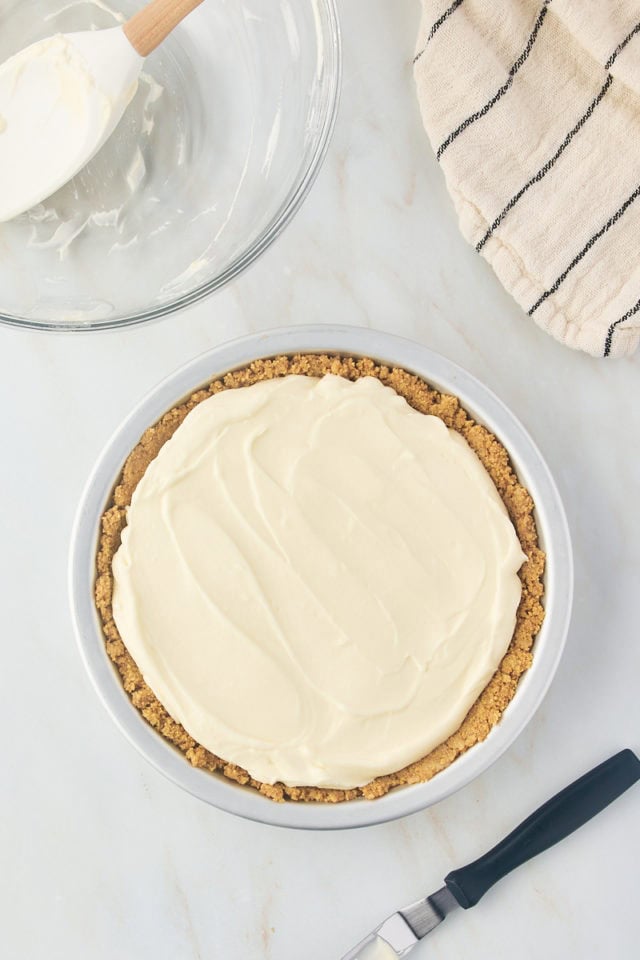 overhead view of s'mores pie filling spread in a graham cracker crust