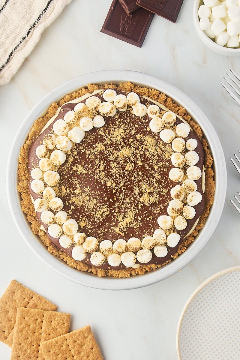 overhead view of s'mores pie on a marble countertop