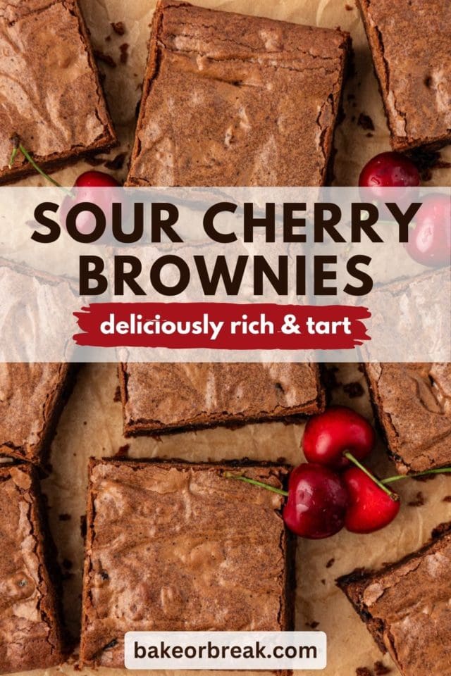 Dark chocolate sour cherry brownies arranged on parchment paper; text overlay "sour cherry brownies deliciously rich & tart bakeorbreak.com"