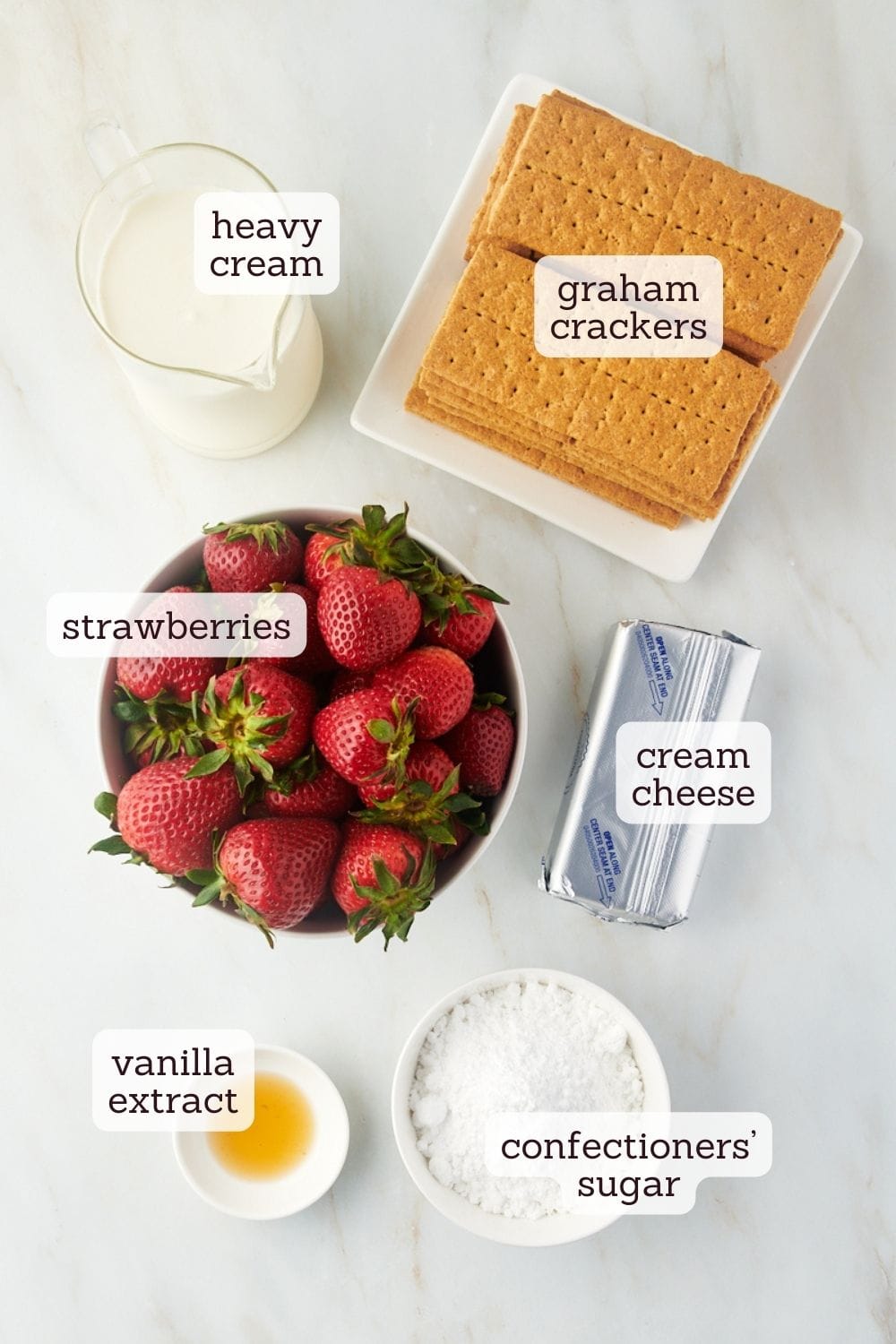 Overhead view of ingredients for strawberry icebox cake