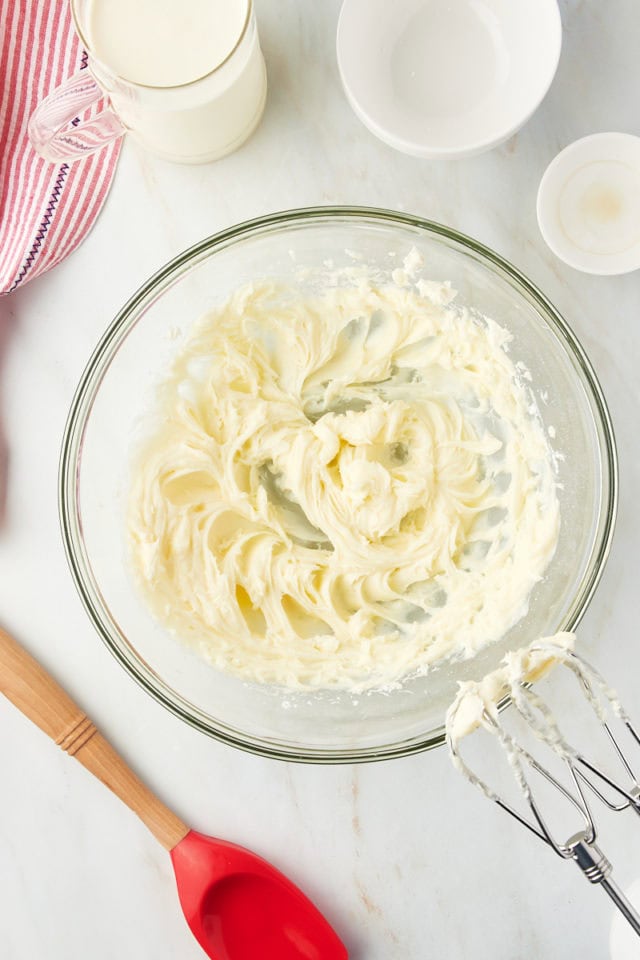 Overhead view of whipped cream cheese in mixing bowl