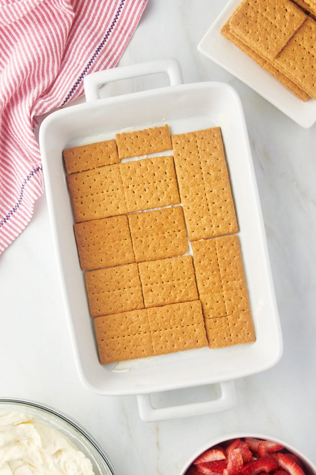 Overhead view of graham cracker layer for strawberry icebox cake