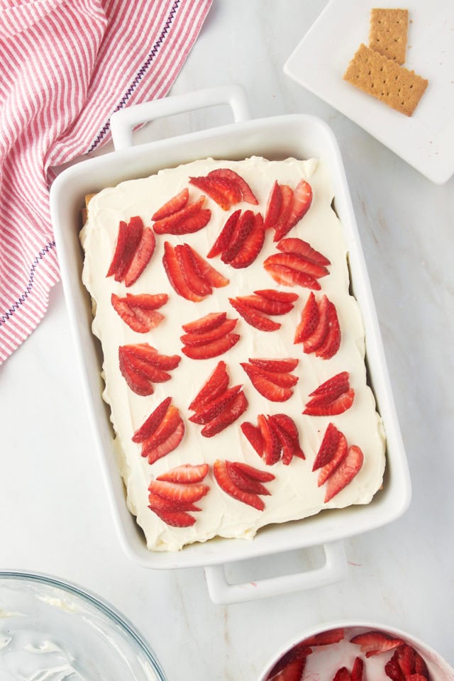 Overhead view of strawberry icebox cake in 9x13 dish