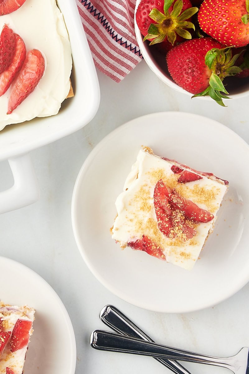 Overhead view of strawberry icebox cake square on plate