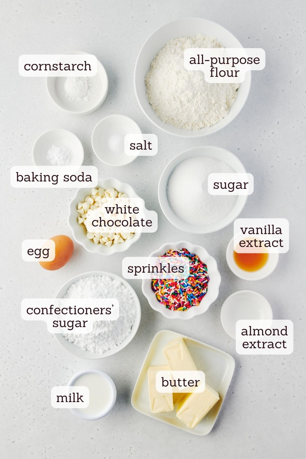 overhead view of labeled ingredients for sugar cookie cake