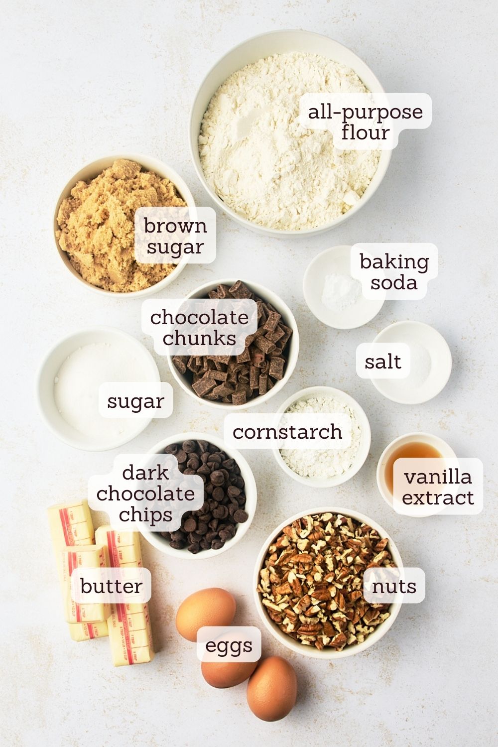 overhead view of labeled ingredients for thick chocolate chip cookies