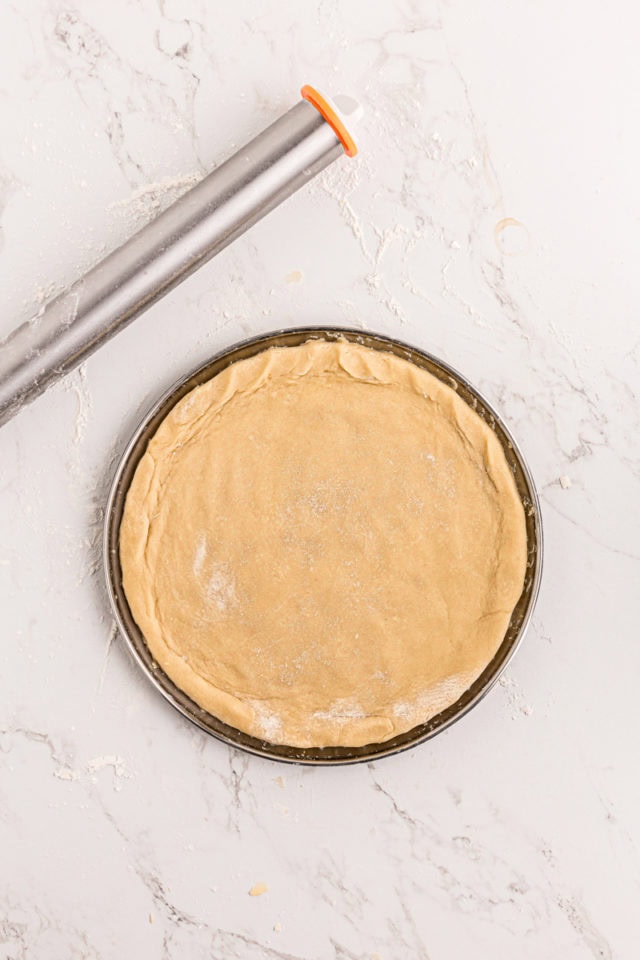 overhead view of sugar cookie crust for fruit pizza on a pizza pan