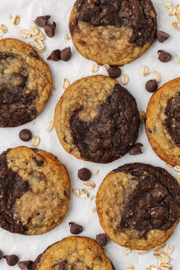 overhead view of marbled chocolate chip cookies on a white and beige countertop