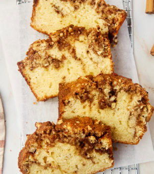 overhead view of four slices of cinnamon swirl bread on parchment paper