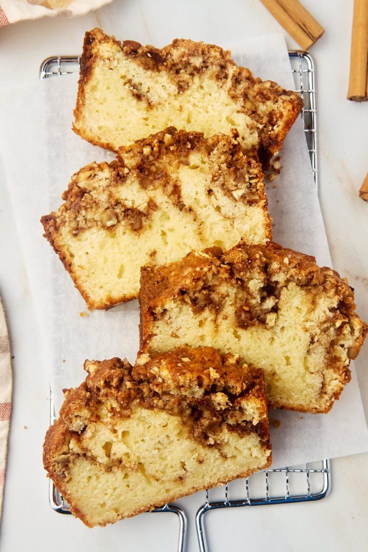 overhead view of four slices of cinnamon swirl bread on parchment paper