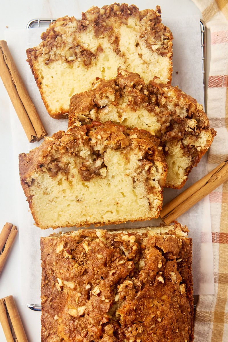 overhead view of partially sliced cinnamon swirl bread on parchment paper