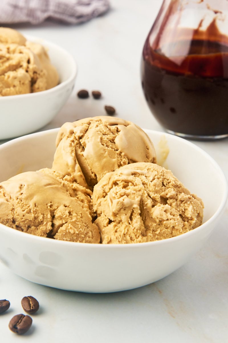 three scoops of coffee ice cream in a white bowl